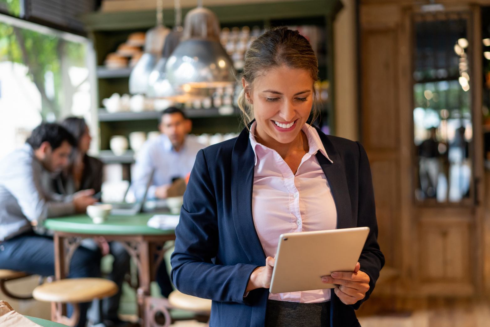 Happy manager working at a restaurant